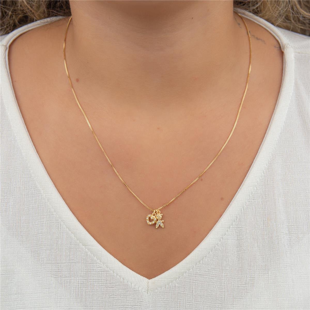 COLAR FOLHEADO A OURO MENINO COM CORAÇÃO VAZADO