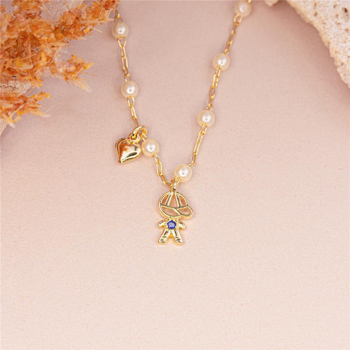 COLAR FOLHEADO A OURO DE PÉROLAS E COM MENINO E MINI CORAÇÃO