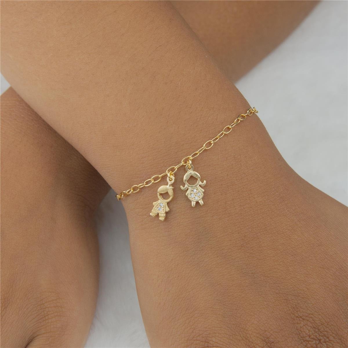 PULSEIRA FOLHEADO A OURO MENINO E MENINA DE ZIRCÔNIAS