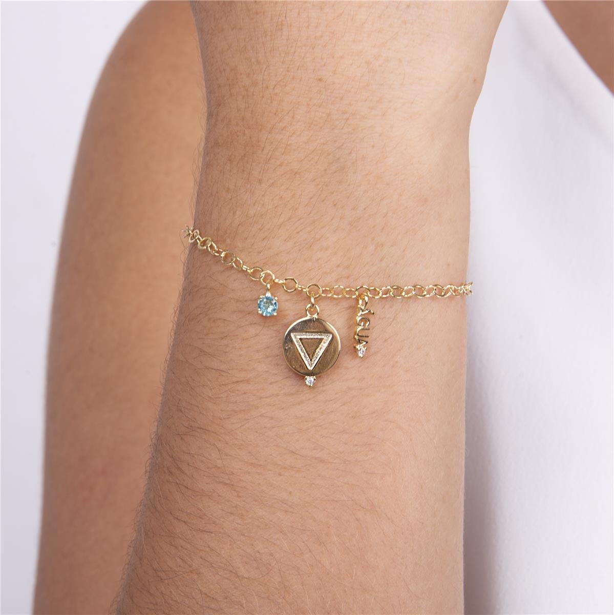 PULSEIRA FOLHEADO A OURO COM SIMBOLO E PALVRA DO ELEMENTO ÁGUA