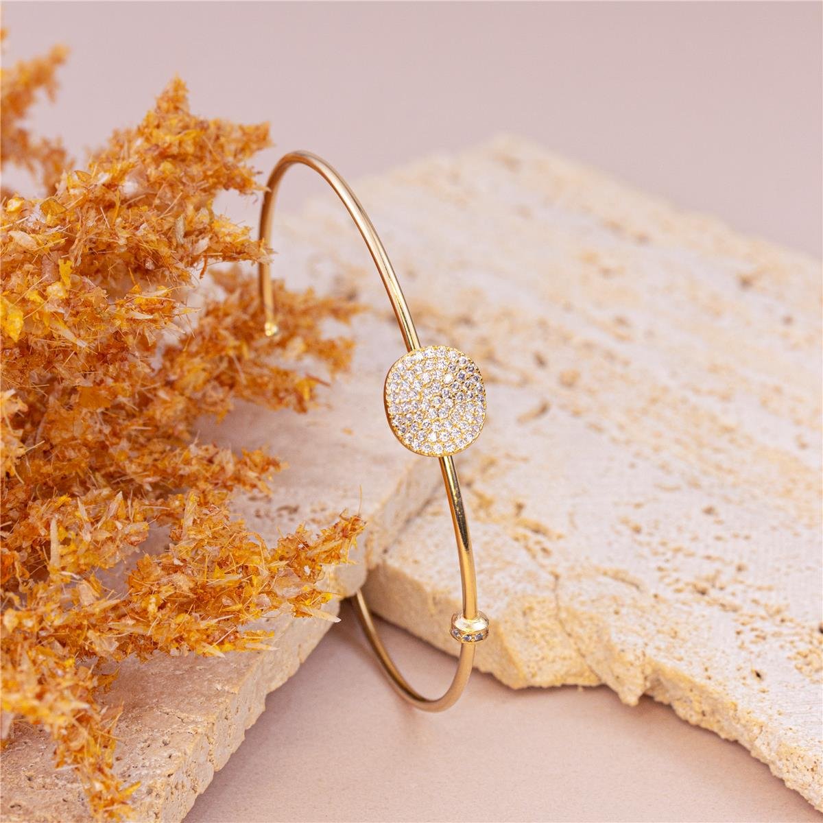 BRACELETE FOLHEADO A OURO COM MINI SEPARADO E FORMA REDONDA E ONDULADA