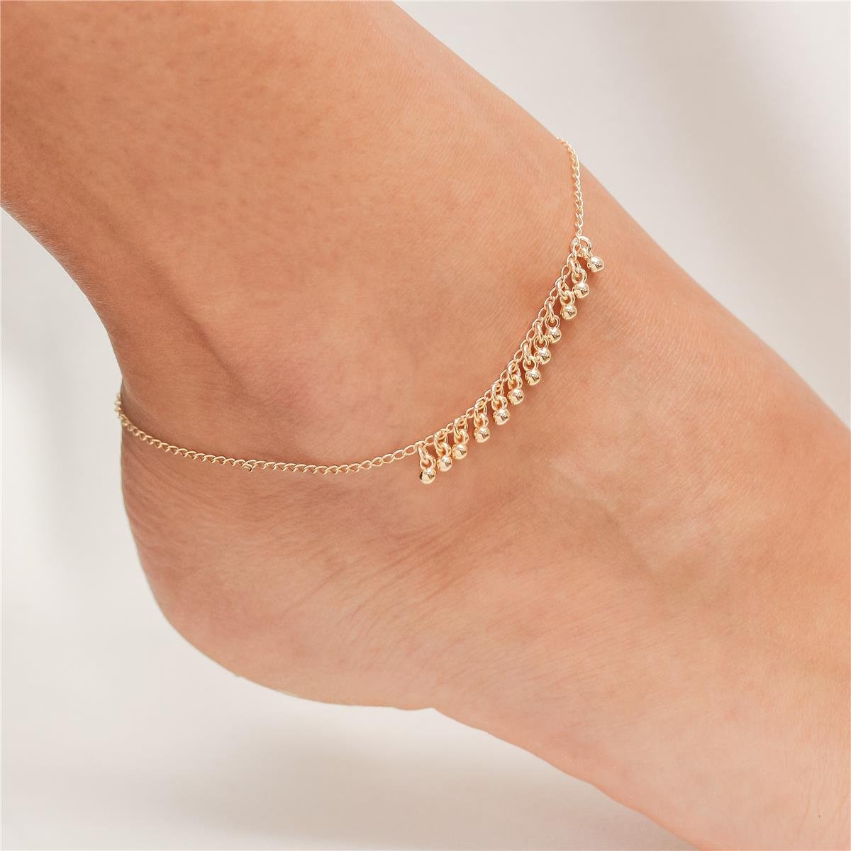 TORNOZELEIRA FOLHEADO A OURO COM BOLINHAS PENDURADAS