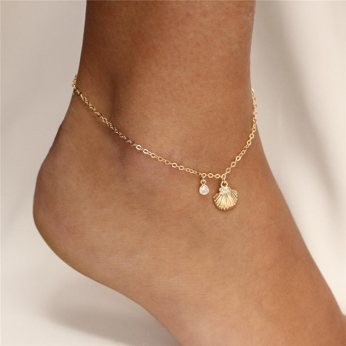 TORNOZELEIRA FOLHEADO A OURO CONCHA E COM ZIRCÔNIA 