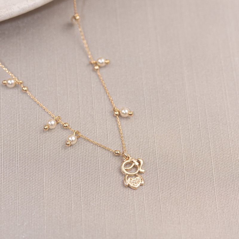 COLAR FOLHEADO A OURO COM PÉROLAS E MENINA